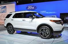 the white ford explorer is on display at an auto show