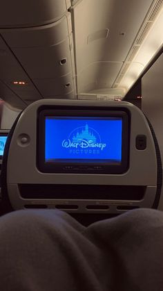 the entertainment system on an airplane is blue and white with disney's logo in it