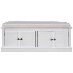 a white bench with two doors and drawers