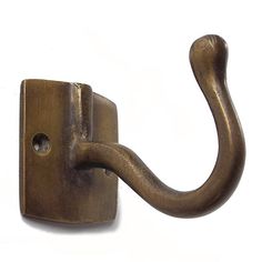 a metal hook on the side of a white wall