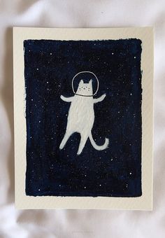 a white cat with a halo on its head is standing in the middle of space