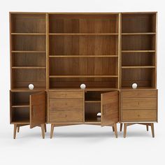 an open bookcase with drawers and two doors