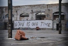 an abandoned building with graffiti on the wall