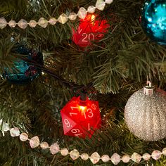 a christmas tree with ornaments hanging from it's branches