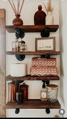 some shelves with candles and other items on them