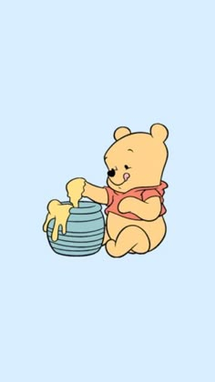 a winnie the pooh bear sitting on top of a bowl