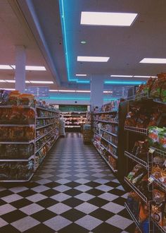 an empty grocery store aisle with shelves full of food