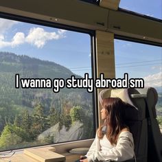 a woman sitting at a desk in front of a window with the words i wanna to study