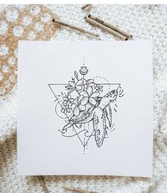 a drawing of flowers and a turtle on a piece of paper