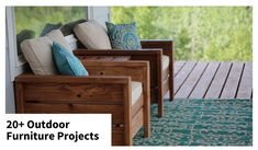 two wooden chairs sitting on top of a porch next to a blue rug and window