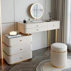 a white dressing table and stool with a round mirror on it in front of a window