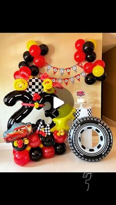 some balloons are in the shape of mickey mouses and other items for a birthday party