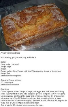 a loaf of bread sitting on top of a pan covered in sugar and icing