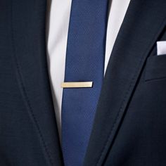 This matte gold-tone tie clip, stretching a handsome 4 cm, isn't just a piece of metal—it's a declaration of style. Crafted with a robust alloy and featuring a strong spring clip, it's designed in Denmark to keep your tie in impeccable position while adding a stunning, attractive flair to your ensemble. Elegant and timeless, it's the perfect accessory for men who appreciate a touch of charm in their wardrobe. Gold Tie Clip, Gold Tie, Matte Gold, Clip Ins, Tie Clip, Stretching, Denmark, Gold Tones, For Men