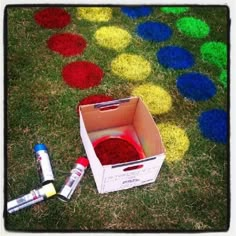 an open box with some paint on the ground