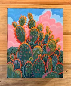 an acrylic painting of a cactus in front of a pink and blue sky