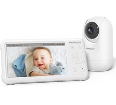 a baby monitor and camera sitting next to each other