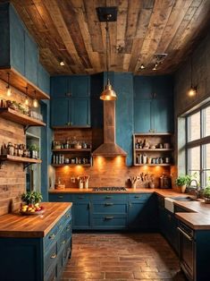 a large kitchen with blue cabinets and wooden floors, along with an island in the middle