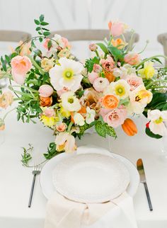 a white plate topped with a bouquet of flowers