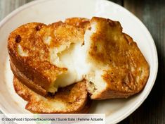 two pieces of french toast on a white plate