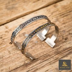 Made of tough solid stainless steel, this rune bracelet is stylish and adjustable. You can choose between the single silver color or the dual color version with silver and gold. The top of this piece is equipped with runes from the Elder Futhark so you'll be able to craft your own spell on whichever wrist you choose! ⚔️✨ Wedding Arms, Viking Arm Rings, Nordic Wedding, Viking Jewellery, Elder Futhark Runes, Norse Jewelry, Futhark Runes, Elder Futhark, Viking Bracelet