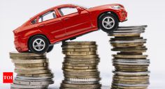 a red toy car on top of stacks of coins