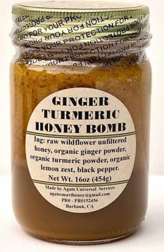 ginger tumeric honey bomb in a glass jar on a white background with the label above it