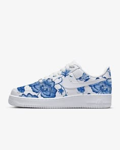 Authentic Nike Air Force 1 Sneakers customized with stunning blue florals. Choose your size and get ready for an amazing experience! Your sneakers are guaranteed authentic from Nike and will be carefully hand painted with the highest quality, richly pigmented leather paints. The designs will be sealed for a lasting finish. Looking for a different color design, just ask! I am happy to create any design or color that you would like. Or check out my other listings for more options. I am also happy Nike Flower Shoes, Sneakers Customized, Customized Sneakers, Whimsical Shoes, Air Force 1 Nike, Air Force 1 Sneakers, Custom Painted Shoes, Painted Sneakers, Tie Sneakers