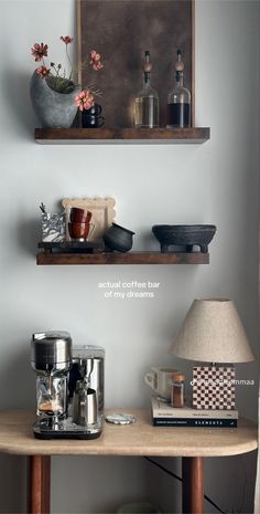 two shelves with coffee cups and other items on them