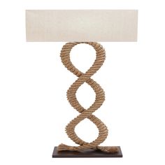 a rope lamp with a white shade on it's side and a wooden base