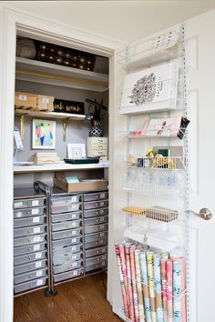 an organized closet with lots of crafting supplies and storage bins on the shelves