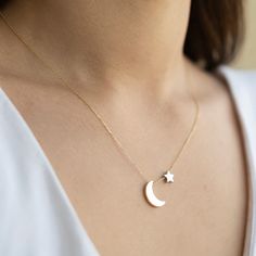 14K Solid Gold Crescent Moon Star Necklace, Gold Moon & Star Charm Necklace, Minimalist Jewelry, Mystic Gift For Her, Jewelry for Women *Free Express International Shipping *Free returns within 14 days from the order date. *14K solid gold chain is included. NEXT BUSINESS DAY SHIPPING! PRODUCT DETAILS *The moon is yellow(14k gold color) and the star is white 14k gold. *The product is made of 100% 14k Solid Gold and it has a 14K or 585 stamp on item. (We don't sell filled or plated jewelry) *The package includes a gold certificate.  *The product includes 14K solid gold chain. *Every package comes in a gift box. *14K gold indicates that the product is produced from 58% pure gold. *Chain length: You can select in variation part. *The product is yellow gold. *       Made in Türkiye. ORDER PROCE Moon Star Necklace, Necklace Minimalist Jewelry, Gold Crescent Moon, Gold Certificate, Star Necklace Gold, Star Charm Necklace, Solid Gold Necklace, Solid Gold Chains, Gold Moon