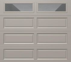 a gray garage door with two windows