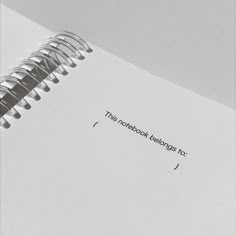 an open notebook with the words, this notebook belongs to