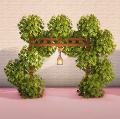 an arch made out of plants with a lantern hanging from it's center piece