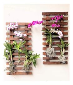 two wooden pallets with flowers and plants on them