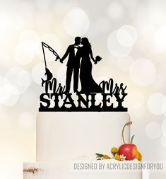 a wedding cake topper that says mr and mrs stanley with an image of a bride and groom