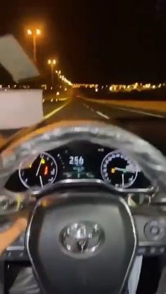 the dashboard of a car is shown at night