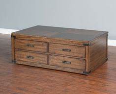 a wooden box sitting on top of a hard wood floor