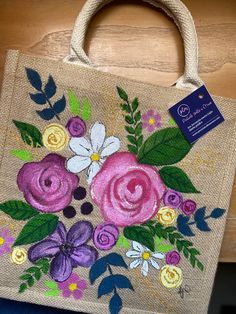 a handbag with flowers painted on it