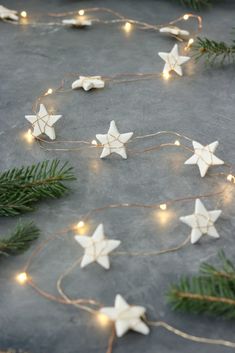 some white stars and lights on a table