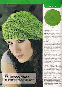 a woman wearing a green knitted hat