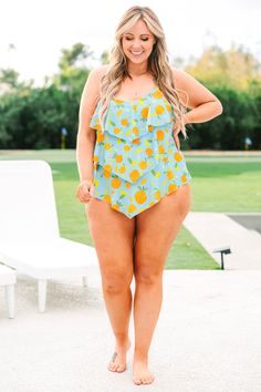 This swimsuit is calling your name! This chic swimmie has a fun orange print you can wear with your favorite cover-ups and sandals! It's comfortable for all day wear, has a figure-flattering one-piece design, and features the cutest ruffles along the body! Wear this swimsuit all season long! 82% Polyamide, 18% Elasthane Playful Summer Beach Tankini, Playful Summer Tankini For Poolside, Fun Spring Beach Tankini, Playful Tankini For Vacation Beach Season, Playful Tankini For Beach Season Vacation, Playful Tankini For Vacation During Beach Season, Playful Summer Poolside Tankini, Fun Summer Swimming Tankini, Summer Printed One Piece For Poolside