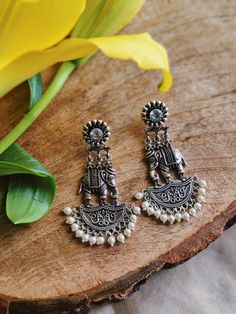 Stunning heavy look ethnic earrings  jhumka jhumki stud Afghani earrings in silver tone  With intricate carved work and sparkling ghunghroos which gives a traditional touch to the earrings  Perfect with ethnic and traditional wear  Can be a perfect gifting option for friends and dear ones  Silver metallic ghunghroo tinkle to create a striking look  With intricate carved word and sparkling ghunghroo which gives a traditional touch to the earring. Silver metallic base tinkle to create a striking l Cheap Metal Jhumkas For Festivals, Cheap Handmade Women's Jhumkas, Cheap Jhumkas For Navratri, Affordable Traditional Silver Earrings, Silver Bohemian Style Drop Jhumkas, Silver Oxidised Earrings, Vintage Indian Jewelry, Earrings Jhumka, Hand Jewelry Rings