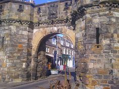 an old brick building with a stone archway