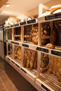 breads and pastries on display in a bakery