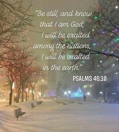 a snow covered park with benches and lights on the trees in the background, bible verse