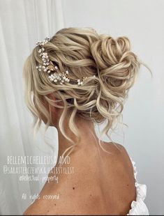 the back of a woman's head wearing a wedding hair comb