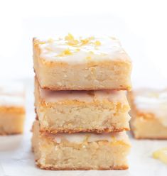 four lemon bars stacked on top of each other