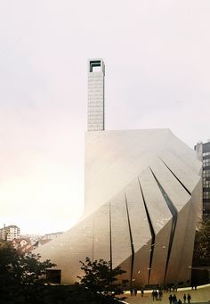 a large building that is next to some trees and people on the sidewalk in front of it